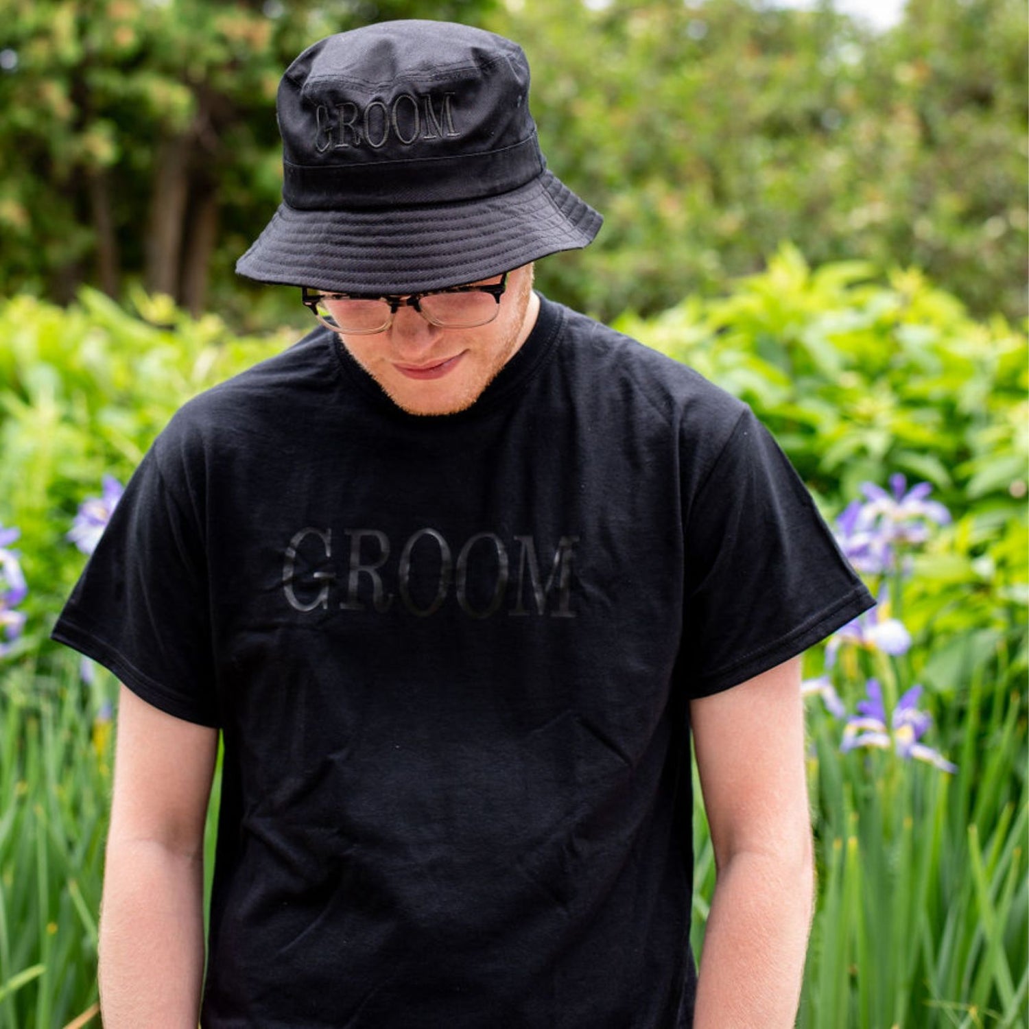 Male wearing a black shirt with Groom printed in black - DSY Lifestyle