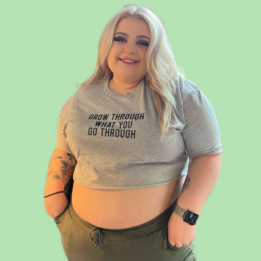 Woman wearing a gray cropped tee with Grow through what you go through printed in black - DSY Lifestyle