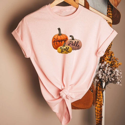 Female wearing a pink unisex t-shirt with Happy Fall Ya&