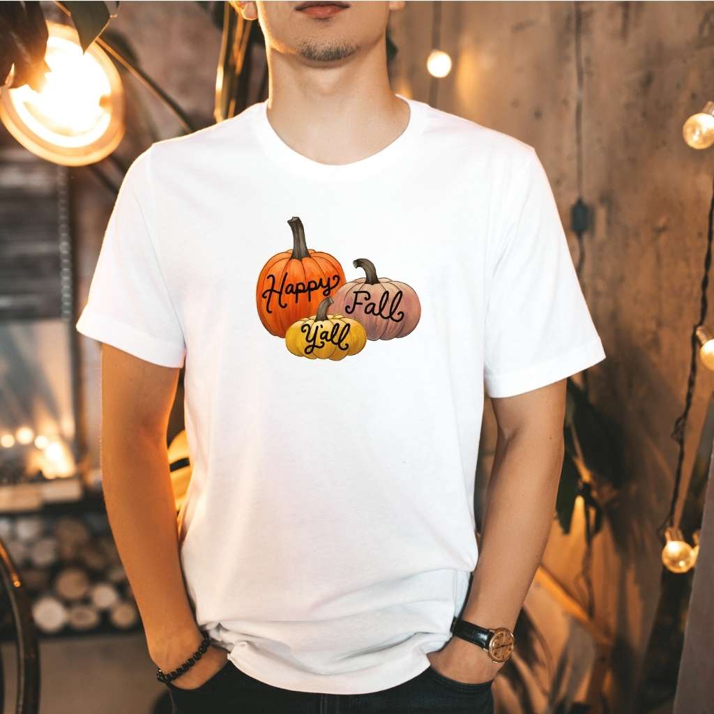 Female wearing a white unisex t-shirt with Happy Fall Ya&