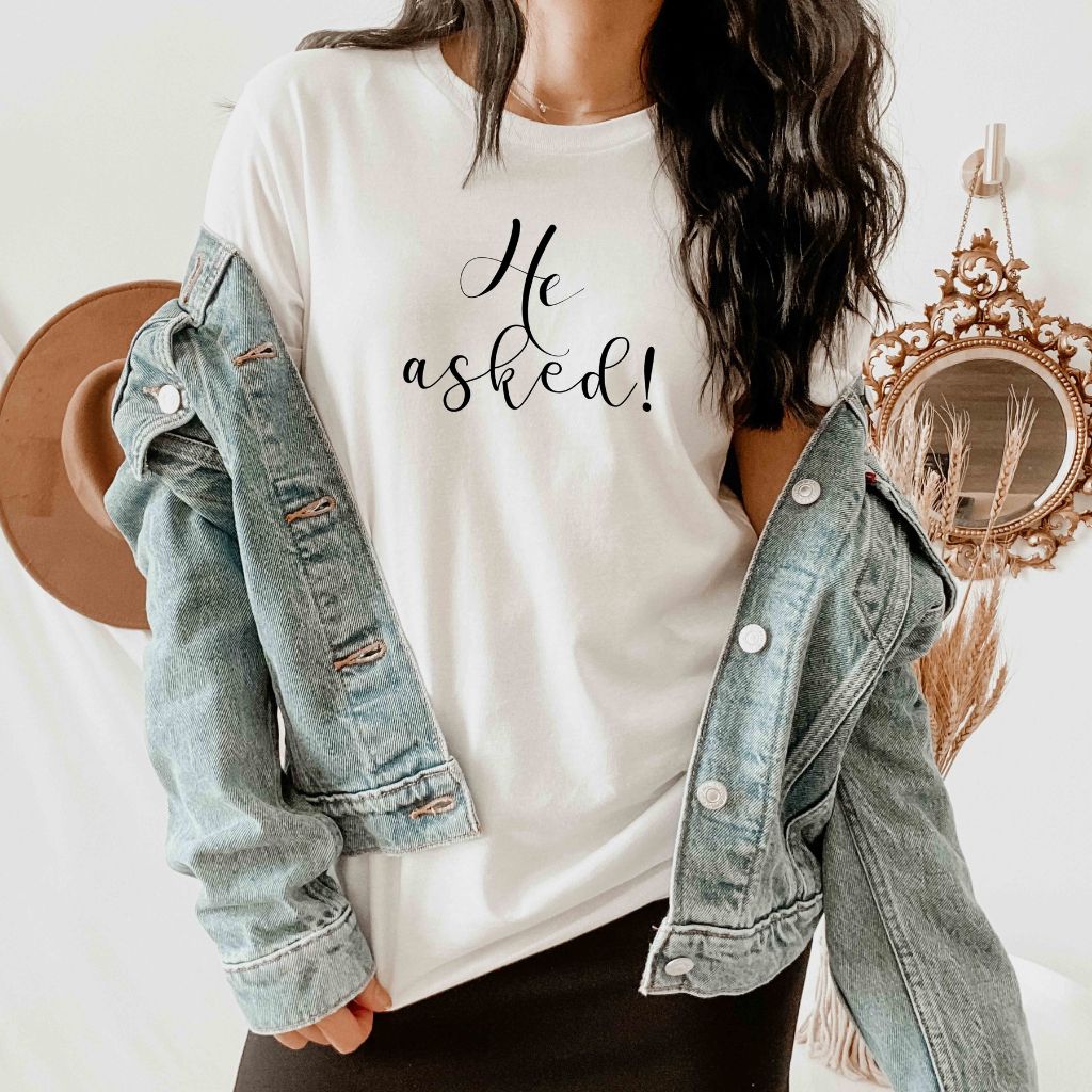 Female wearing white tshirt with He asked! printed under a denim jacket - DSY Lifestyle