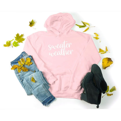 Female wearing a Lt Pink Hoodie Sweatshirt with sweater weather embroidered in the front - DSY Lifestyle