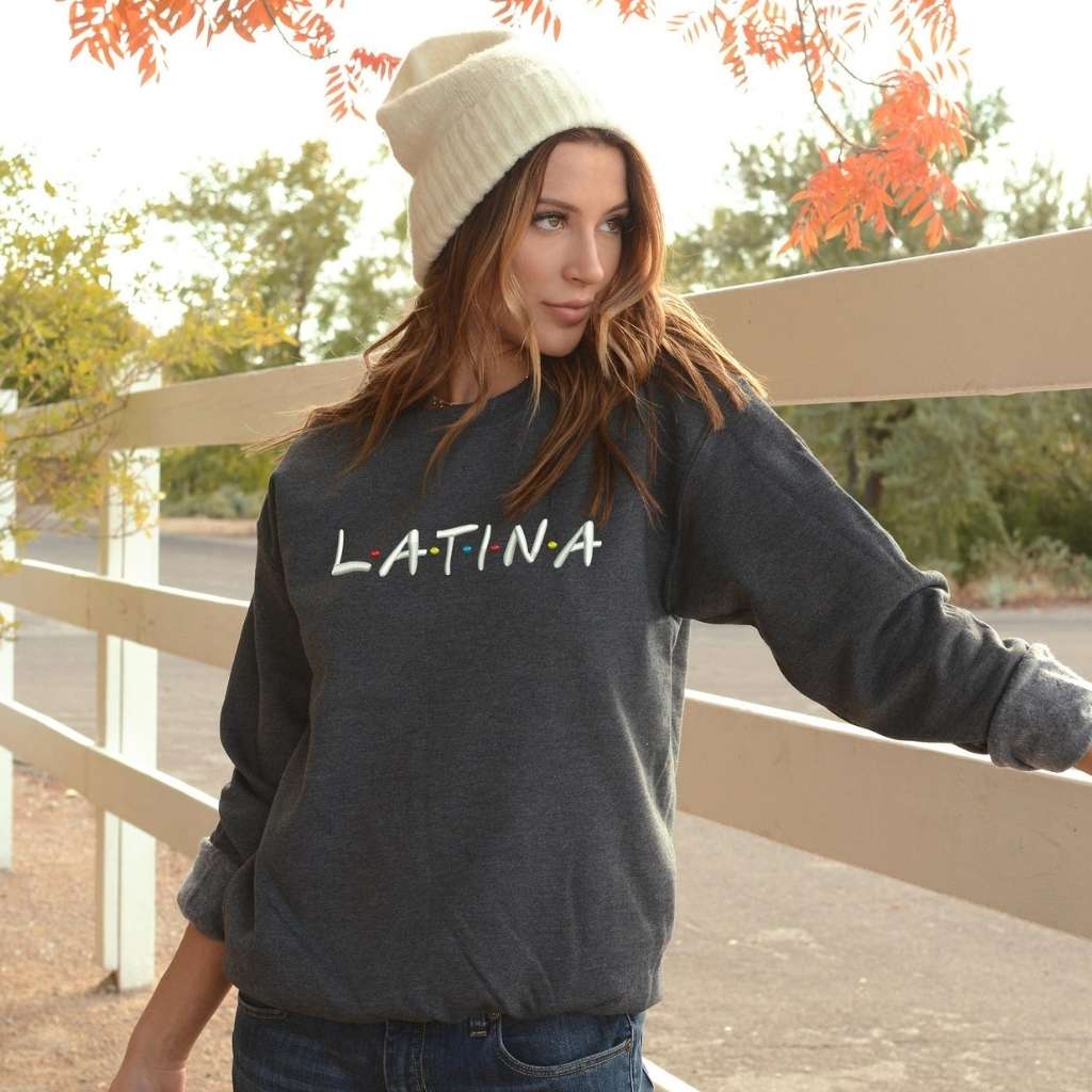 Female wearing a dark heather gray sweatshirt embroidered with Latina in the front - DSY Lifestyle