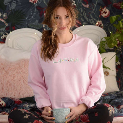 Female wearing a pink sweatshirt embroidered with Latina in the front - DSY Lifestyle