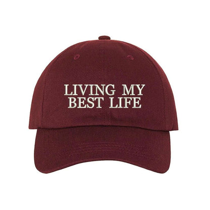 Burgundy baseball hat with Living My Best Life embroidered in white - DSY Lifestyle
