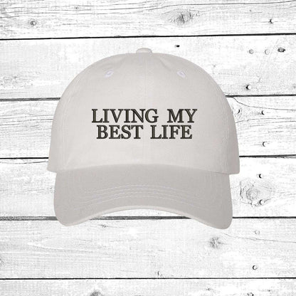 White baseball hat with Living My Best Life embroidered in black - DSY Lifestyle