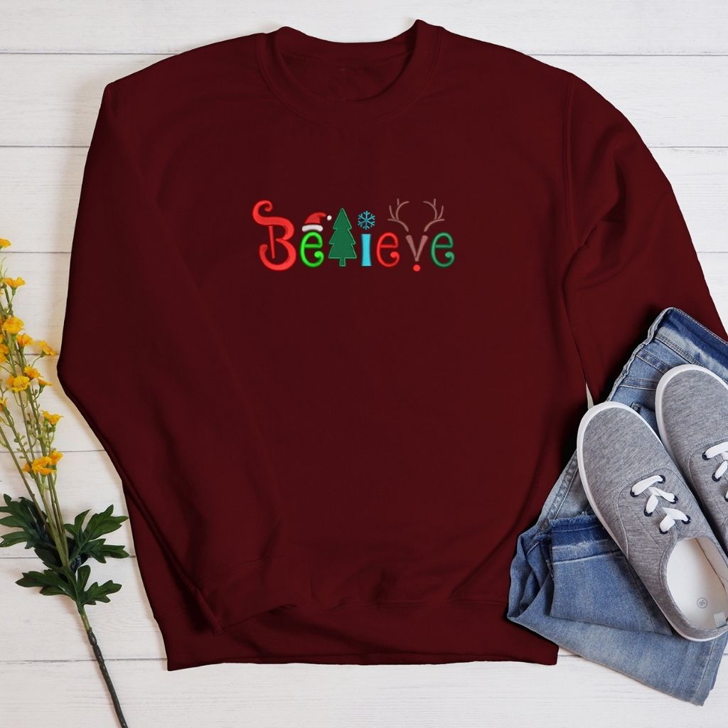 Maroon Sweatshirt embroidered with believe in Christmas Colors- DSY Lifestyle