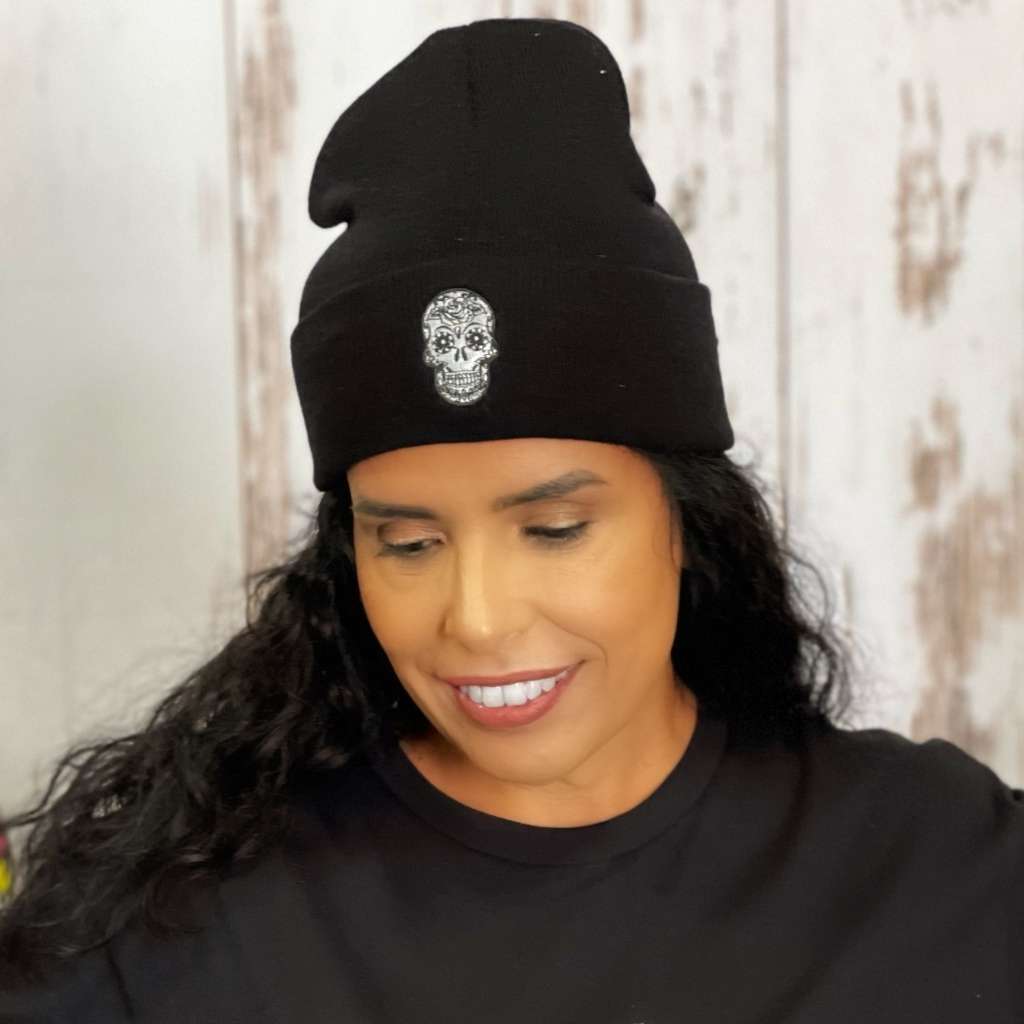 Model wearing black cuffed beanie with sugar skull embroidered on the front - DSY Lifestyle