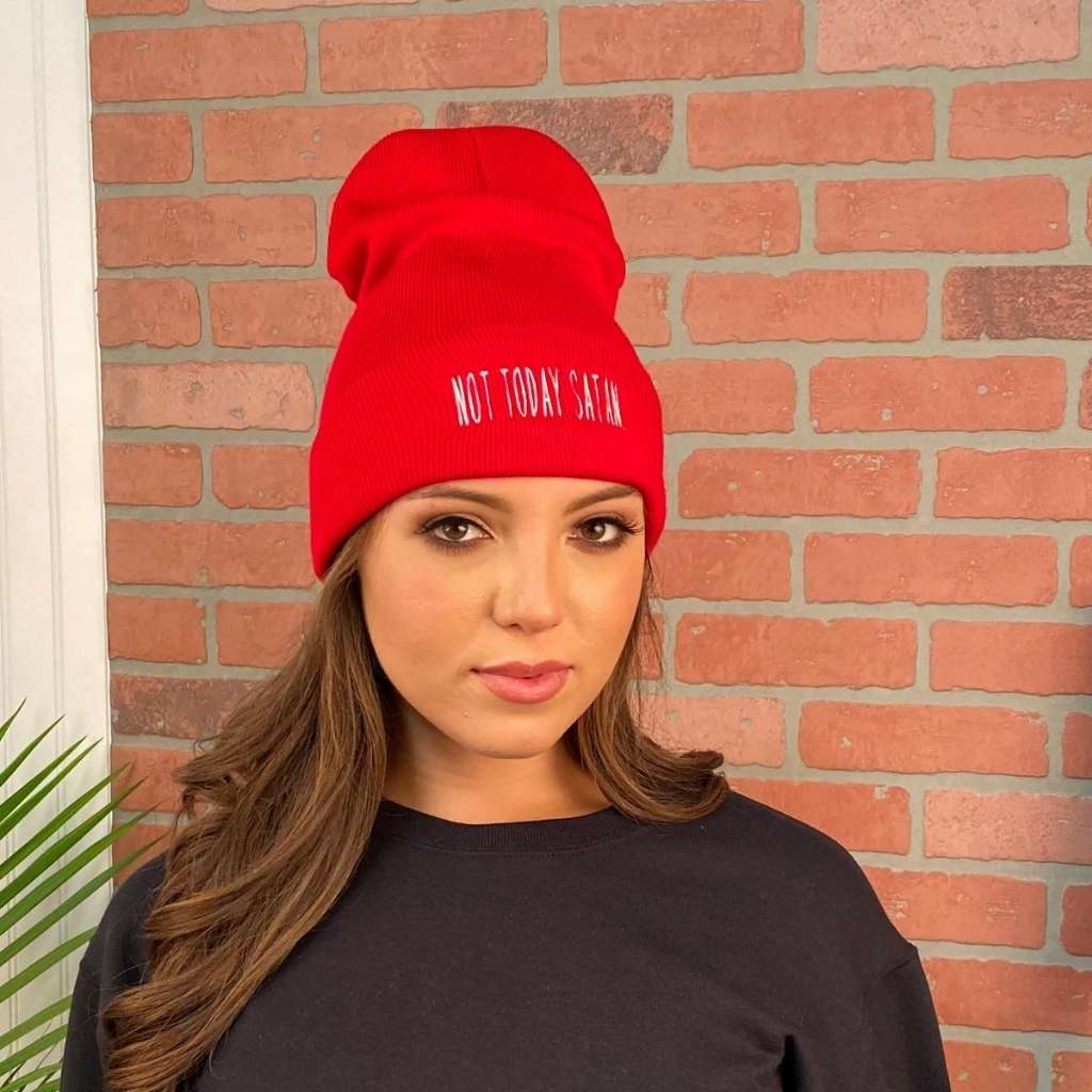 Model wearing Red cuffed beanie embroidered with NOT TODAY SATAN in white - DSY Lifestyle