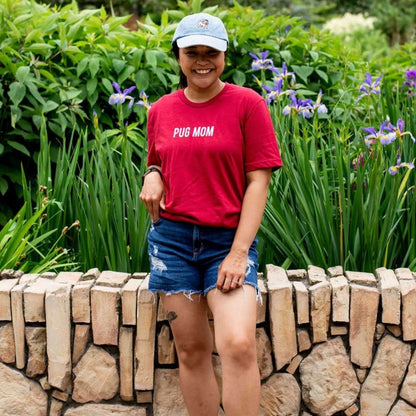 Female wearing a red shirt with Pug Mom printed in the front - DSY Lifestyle