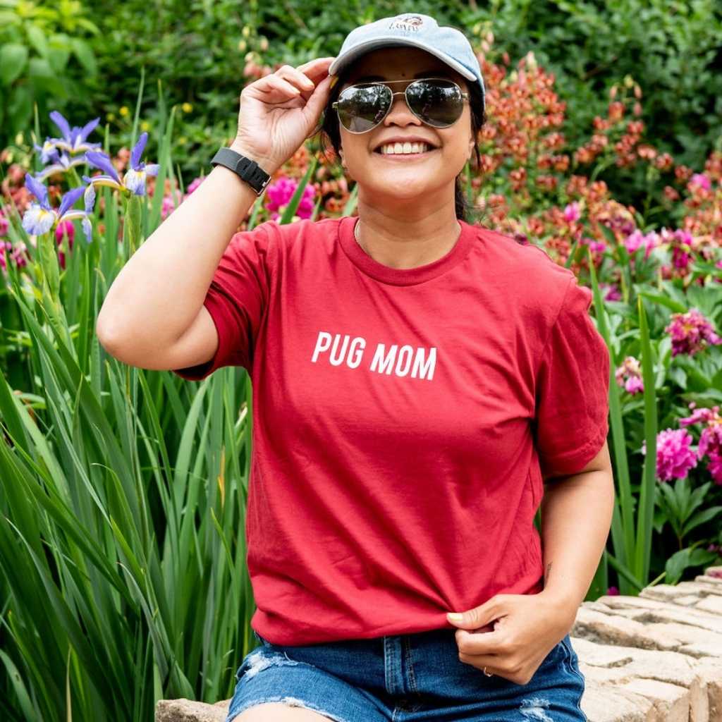 Female wearing a red shirt with Pug Mom printed in the front - DSY Lifestyle