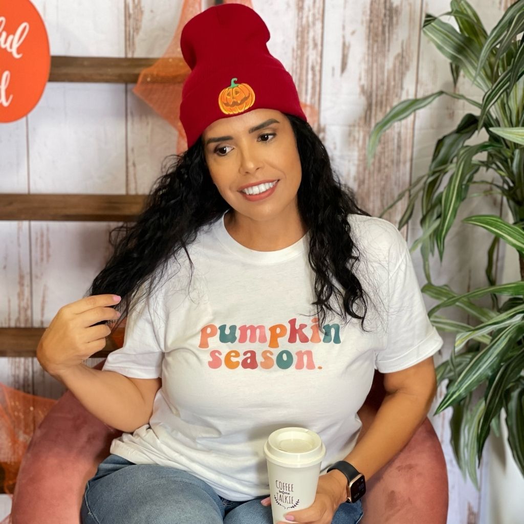Female wearing a white tshirt with pumpkin season printed in the front and wearing a burgundy beanie with a pumpkin embroidered in the front - DSY Lifestyle