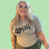 Female wearing a heather gray unisex tee with Radiate Self Love printed in black - DSY Lifestyle