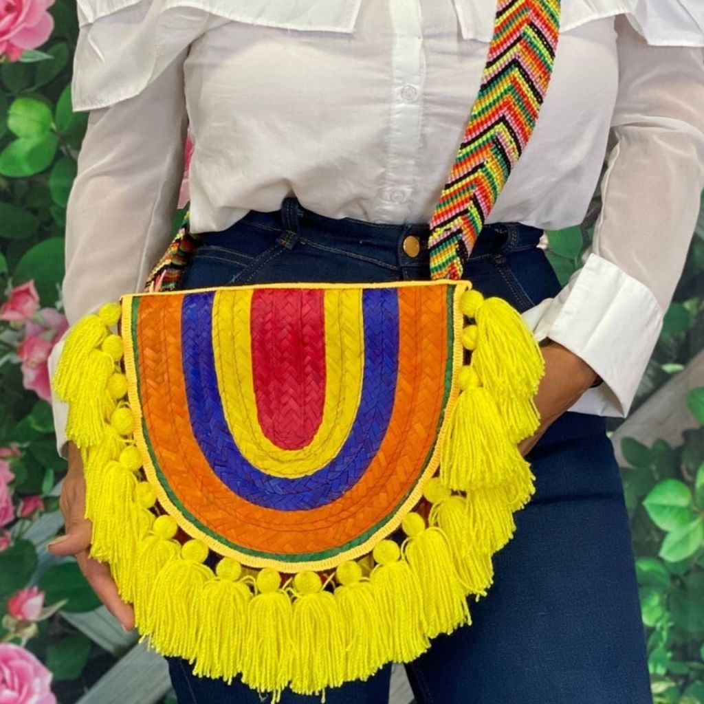 Female wearing a Rainbow Palm Crossover purse with yellow tassels - DSY Lifestyle