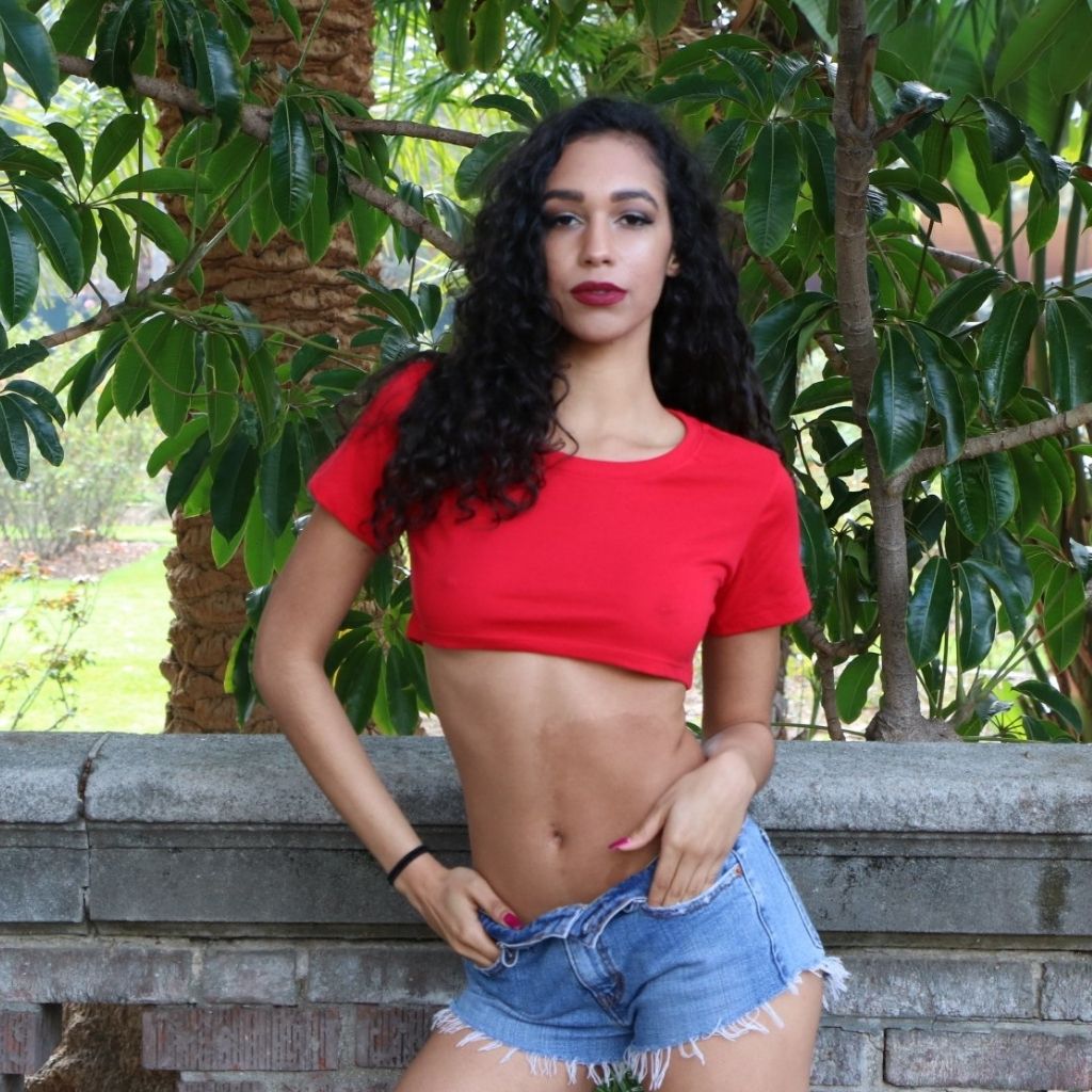 Female wearing red underboob cropped top