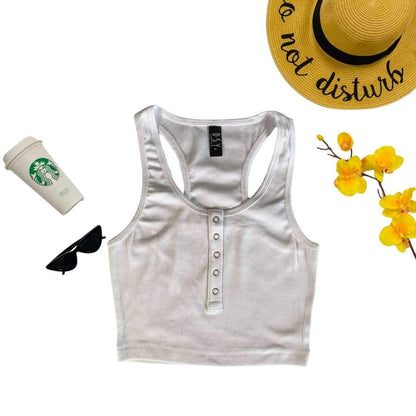 Flat Lay of white racerback crop top with snap closure - DSY Lifestyle
