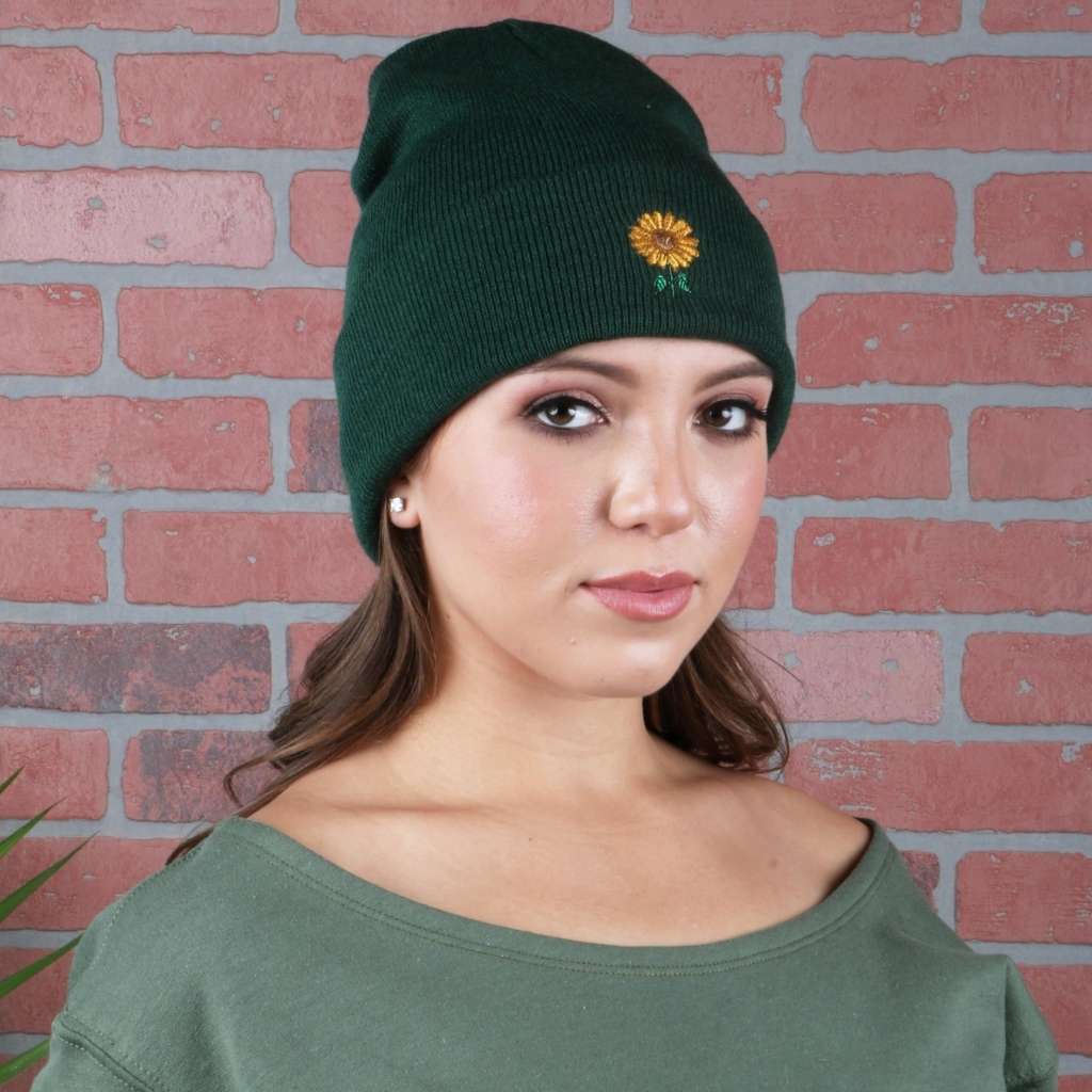 Model wearing forest green cuffed beanie with a sunflower embroidered on the front - DSY Lifestyle