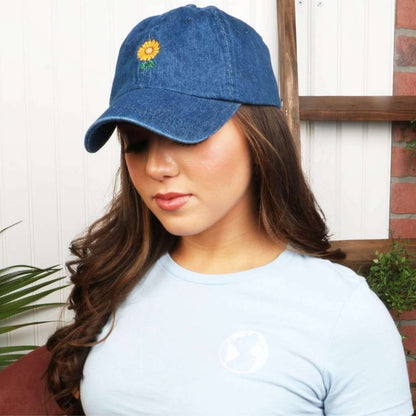 Female wearing a dark denim baseball hat embroidered with a sunflower - DSY Lifestyle