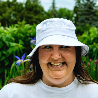 Female wearing a white bucket hat embroidered with Bride in white thread - DSY Lifestyle