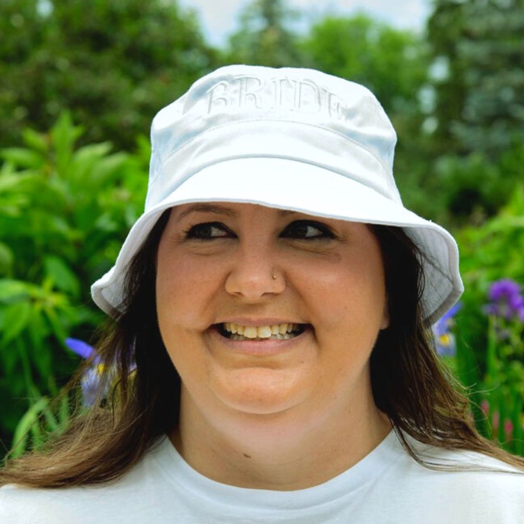 Female wearing a white bucket hat embroidered with Bride in white thread - DSY Lifestyle