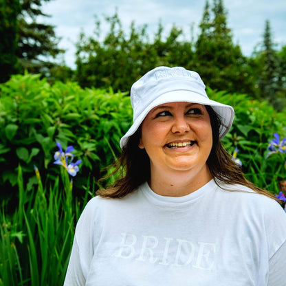 Female wearing a white bucket hat embroidered with Bride in white thread - DSY Lifestyle