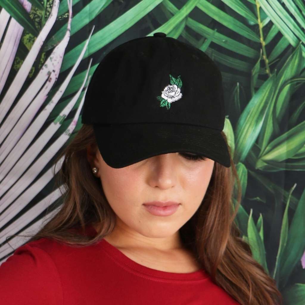 Model wearing black baseball hat with white rose embroidered - DSY Lifestyle
