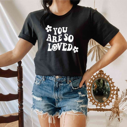 Female wearing a black tshirt with You are so loved - DSY Lifestyle