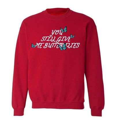 Red sweatshirt with 4 blue butterflies and  You still give me butterflies printed in the front in white - DSY Lifestyle