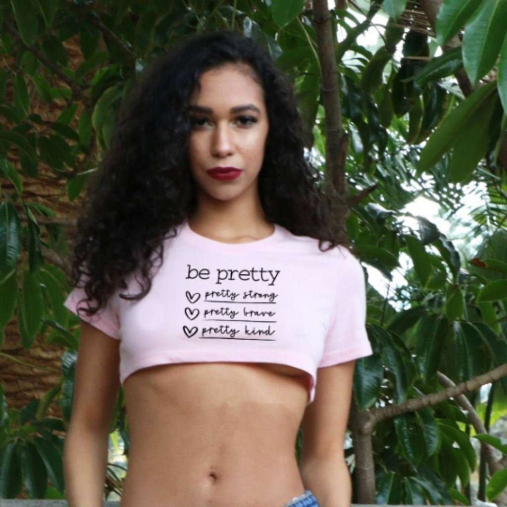 Model wearing pink crop top with Be Pretty printed on it - DSY Lifestyle