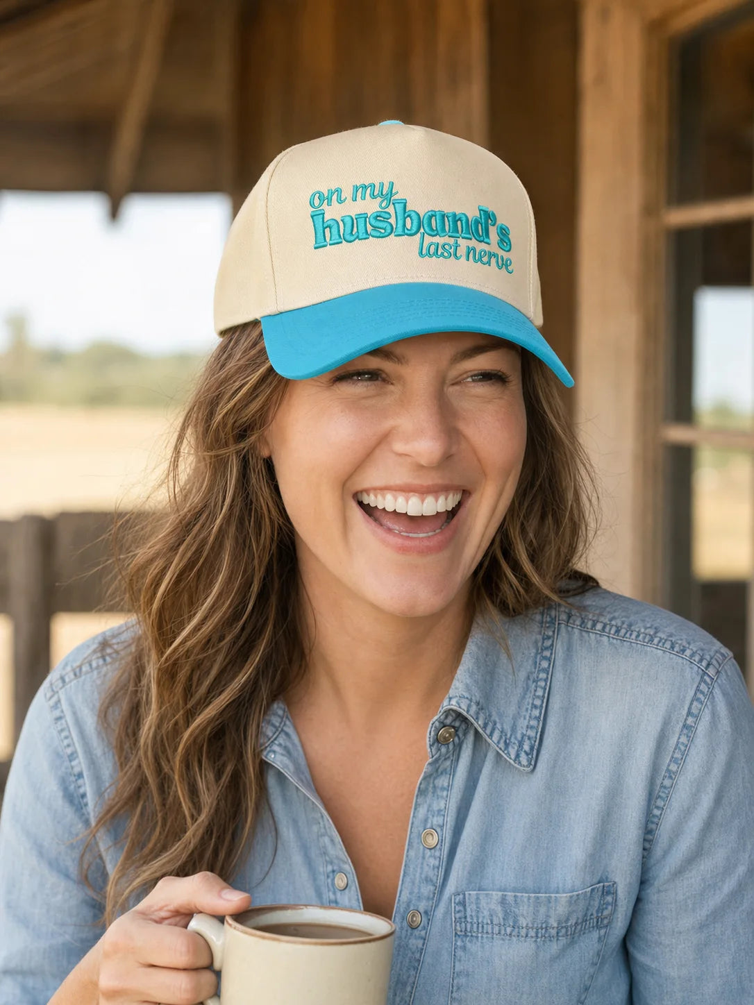 Woman wearing a natural and aqua five-panel trucker hat embroidered On My Husband's Last Nerve